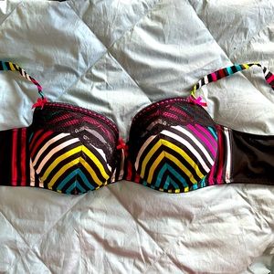Cacique bra 40DD rainbow stripe with pink bows.